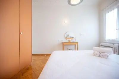 a bedroom with a bed with two towels on it at Aegis Filoppapou suites - Olive in Athens