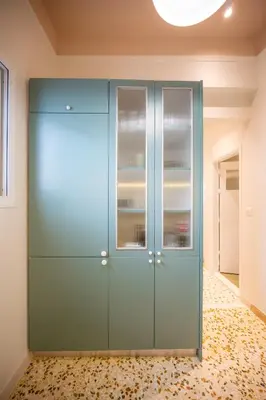 a room with a blue closet with glass doors at Aegis Filoppapou suites - Olive in Athens
