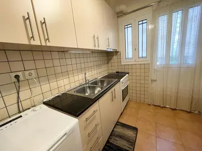 a kitchen with a sink and a counter top at Saronida Beach Nest Apartment in Saronida