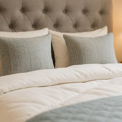 a bed with white sheets and pillows on it at Stay at Premium Syntagma Location in Athens