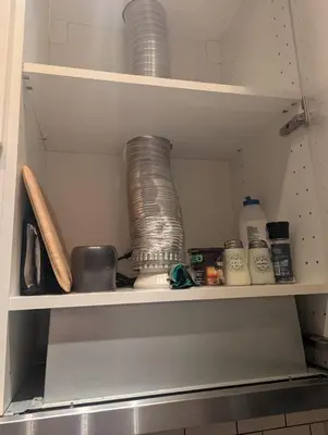 a shelf with a bunch of bowls and other items at Apartment with a view in Athens in Athens