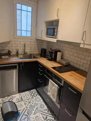 a kitchen with a sink and a stove top oven at Apartment with a view in Athens in Athens