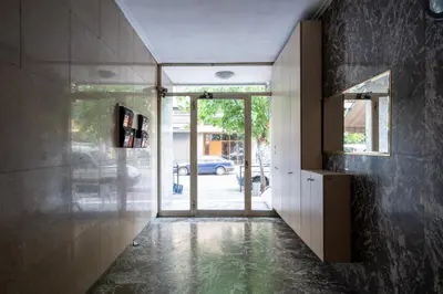 a hallway of a house with a glass door at Luxury Apartment next to the National Museum in Athens