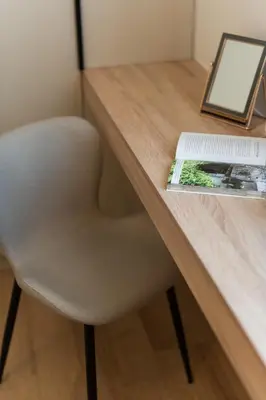 a desk with a chair and a book on it at Luxury Apartment next to the National Museum in Athens