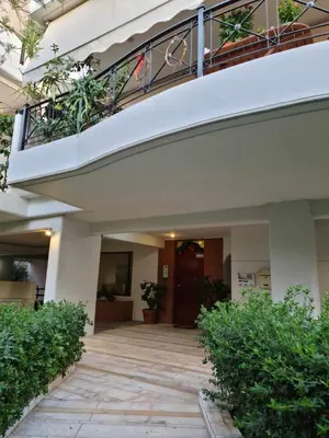a building with a balcony with plants on it at ''Athens Light'' luxury spacy appartment, Agia Paraskevi in Athens