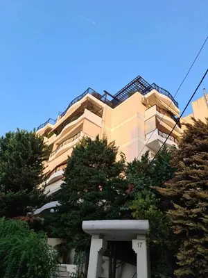 a tall building with trees in front of it at ''Athens Light'' luxury spacy appartment, Agia Paraskevi in Athens