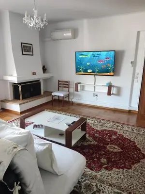 a living room with a couch and a table at ''Athens Light'' luxury spacy appartment, Agia Paraskevi in Athens