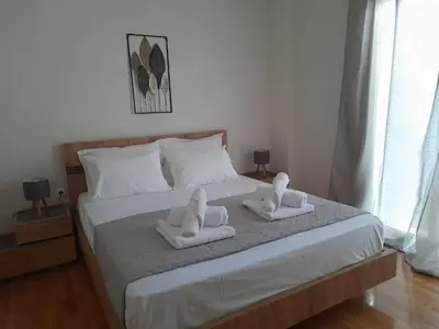 a bedroom with two towels on a bed at Irene Luxe Loft in Piraeus