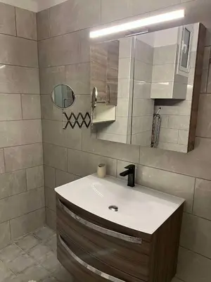 a bathroom with a sink and a mirror at Thissio Apartment by Life Houses in Athens