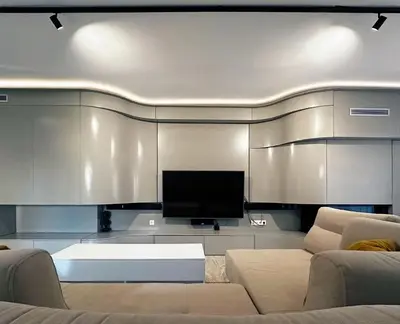 a living room with a couch and a flat screen tv at Seaside Charming Apartment in Alimos in Athens