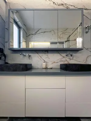a bathroom with two sinks and a mirror at Seaside Charming Apartment in Alimos in Athens