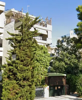a christmas tree in front of a building at Seaside Charming Apartment in Alimos in Athens