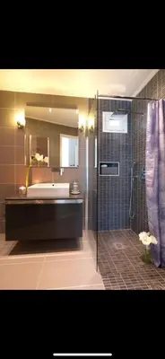 a bathroom with a shower and a sink and a tub at Small Villa in Palaio Psichiko in Athens