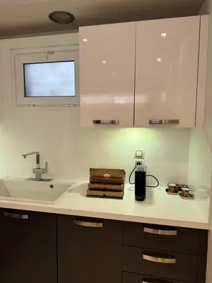 a kitchen with a sink and a counter top at Small Villa in Palaio Psichiko in Athens