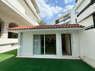 a small white building with a red roof at Small Villa in Palaio Psichiko in Athens