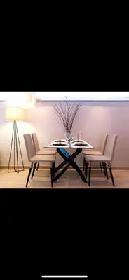 a table with two chairs and a table with a vase at Small Villa in Palaio Psichiko in Athens