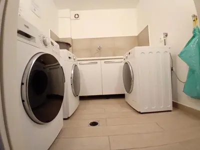 a laundry room with a washer and dryer at Elvis 2-Bedroom Apartment in Athens in Athens