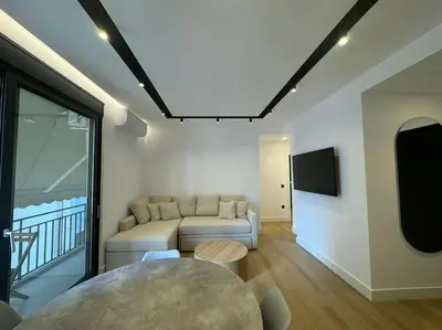 a living room with a couch and a table at BlueMotion - PortSuite 4A in Piraeus