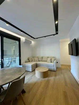 a living room with a couch and a table at BlueMotion - PortSuite 4A in Piraeus