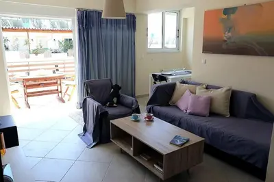 a living room with a couch and a coffee table at Fly me to the moon! in Athens