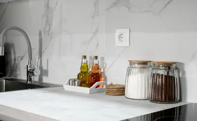 a kitchen counter with bottles of wine and spices at Halo - Luxury Studio in Athens in Athens