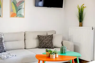 a living room with a couch and a table at Halo - Luxury Studio in Athens in Athens