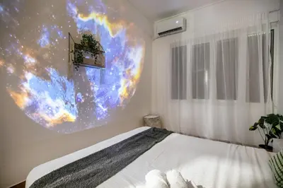 a bedroom with a large poster on the wall at Mellow 2-Bedroom Apartment in Athens in Athens