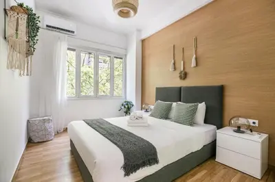 a bedroom with a large bed and a window at Mellow 2-Bedroom Apartment in Athens in Athens