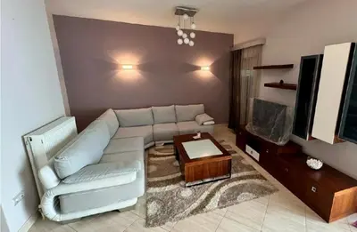 a living room with a couch and a tv at Cityacropol in Athens