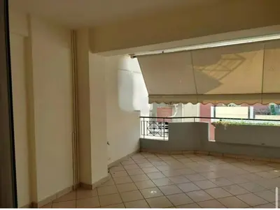 an empty room with a window and a tiled floor at Cityacropol in Athens