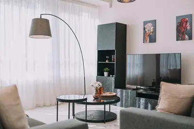 a living room with a table and a couch at ACM Acropolis Apartments in Athens