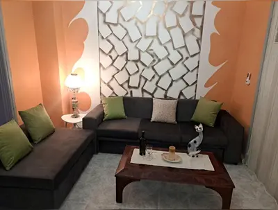 a living room with a couch and a coffee table at Horizon view apartment port of Piraeus in Piraeus