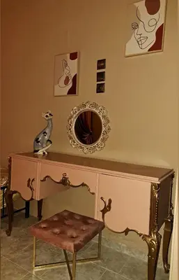 a dressing table with a mirror and a chair at Horizon view apartment port of Piraeus in Piraeus
