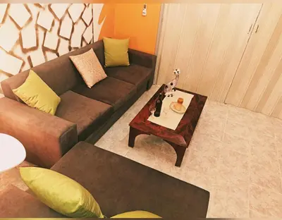 a living room with a couch and a table at Horizon view apartment port of Piraeus in Piraeus