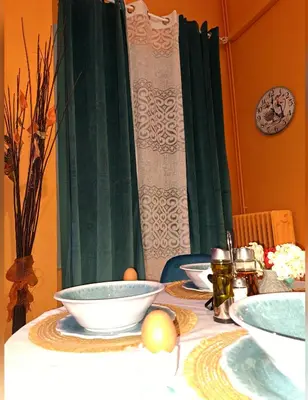 a table with plates and bowls on top of it at Horizon view apartment port of Piraeus in Piraeus