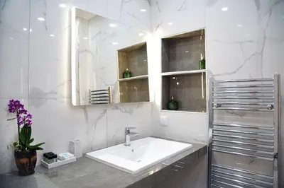a white bathroom with a sink and a mirror at Urban Elegance Retreat VIPGreece in Athens