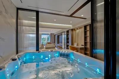 a large blue tub in a room with a living room at The Philosopher's Temple in Athens