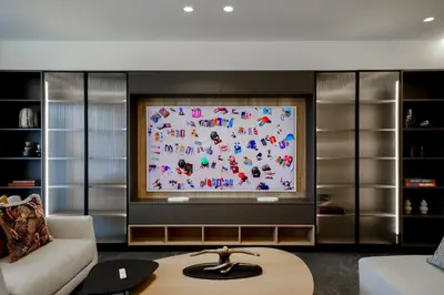 a living room with a large screen television at The Philosopher's Temple in Athens