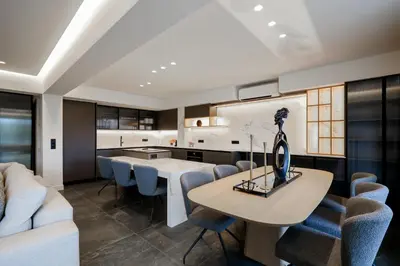 a kitchen and dining room with a table and chairs at The Philosopher's Temple in Athens