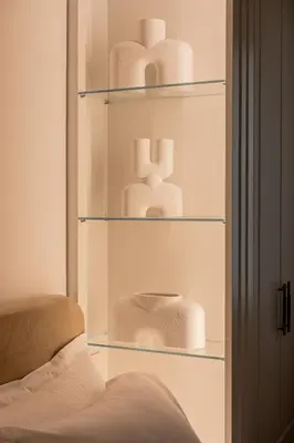 a shelf filled with white towels in a room at Elegant apartment a breath away from the Acropolis in Athens