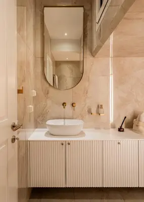 a bathroom with a sink and a mirror at Elegant apartment a breath away from the Acropolis in Athens