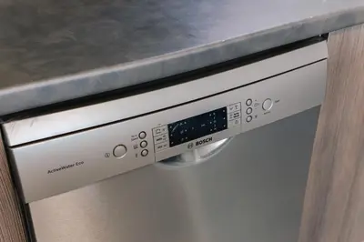 a close up of a dishwasher in a kitchen at Villa Poseidon Athens Riviera in Lagonissi