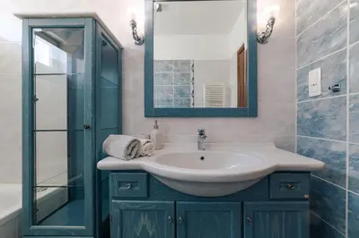 a bathroom with a sink and a mirror at Villa Poseidon Athens Riviera in Lagonissi