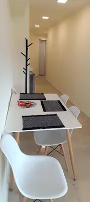 a white table with white chairs and a cross on it at Athens Experience 2 in Athens