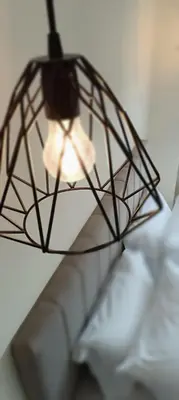 a black and white light hanging from a ceiling at Athens Experience 2 in Athens