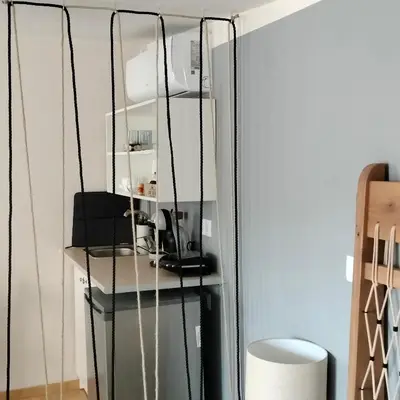 a room with a mirror and a table with a lamp at Gargaretta Suites Wildflower 4 Acropolis Museum District in Athens