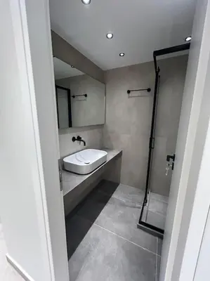 a bathroom with a sink and a shower at BlueMotion - Ferry 65 in Piraeus