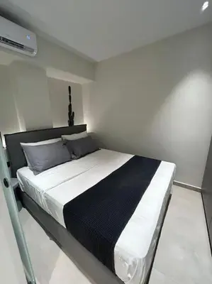 a bedroom with a large bed in a room at BlueMotion - Ferry 65 #2 in Piraeus
