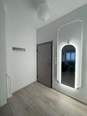 an empty room with a door and a mirror at Ntinos Apartment Center Exarcheia in Athens