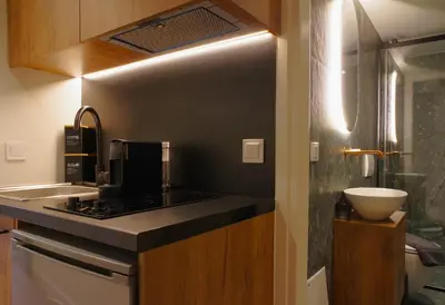 a kitchen with a sink and a counter top at Absolute Athens Acropolis Muses in Athens